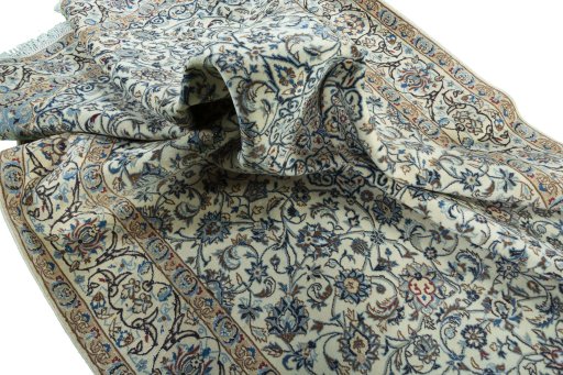 Surface texture of 2000s Nain rug with natural Wool and intricate pattern