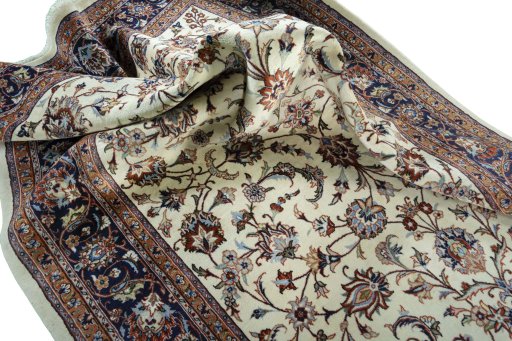Surface texture of 2000s Mashad rug with natural Wool and intricate pattern