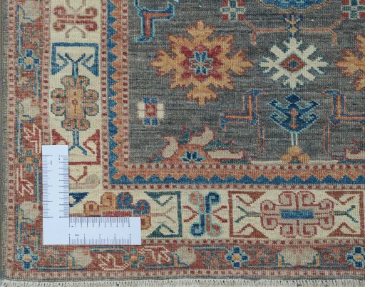 Corner detail of New Kazak rug showing border pattern and Wool pile