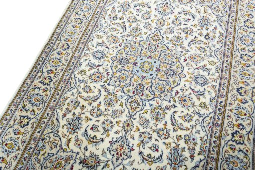 Backside of handmade 2000s Kashan rug showing knot structure and weave density