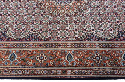 Corner detail of 2000s Moud rug showing border pattern and Wool pile