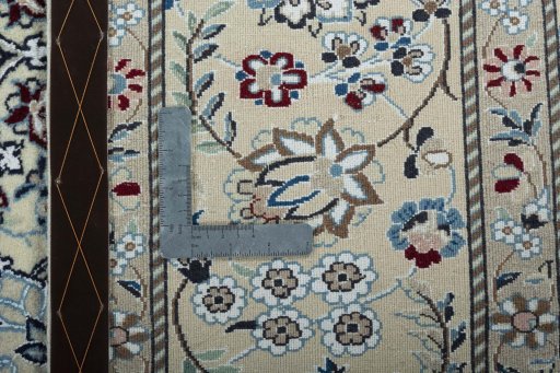 Backside of handmade New Nain rug showing knot structure and weave density