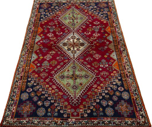 Surface texture of 2000s Shiraz rug with natural Wool and intricate pattern