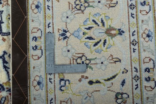 Backside of handmade New Kashan rug showing knot structure and weave density