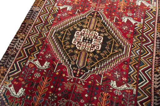 Backside of handmade 2000s Shiraz rug showing knot structure and weave density