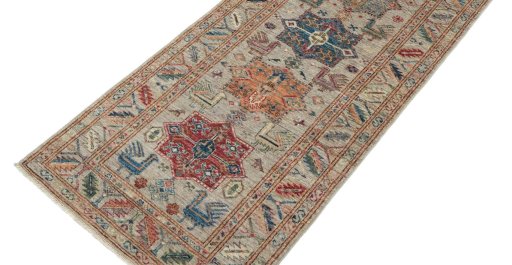 Backside of handmade New Kazak rug showing knot structure and weave density