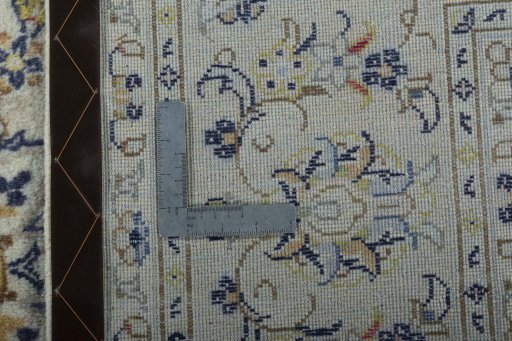 Backside of handmade 2000s Kashan rug showing knot structure and weave density