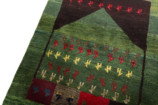 Backside of handmade 2000s Persian Gabbeh rug showing knot structure and weave density