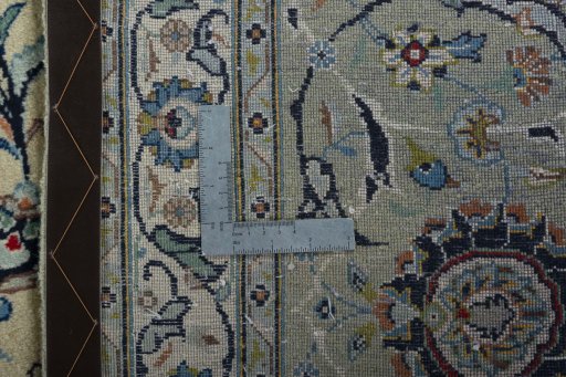 Backside of handmade 2000s Kashan rug showing knot structure and weave density