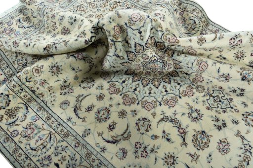 Surface texture of 2000s Nain rug with natural Wool and intricate pattern