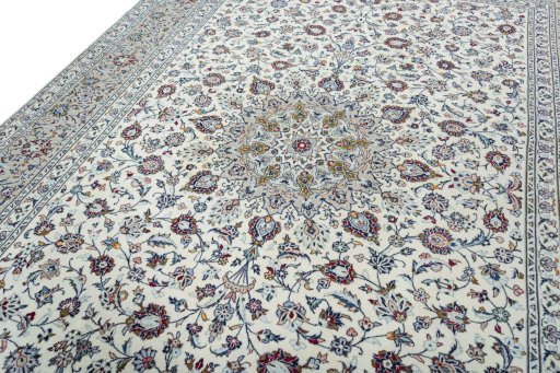Backside of handmade 2000s Kashan rug showing knot structure and weave density