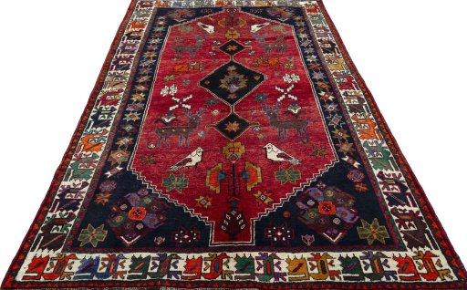 Surface texture of 2000s Shiraz rug with natural Wool and intricate pattern