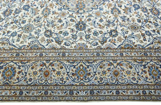 Corner detail of 2000s Kashan rug showing border pattern and Wool pile