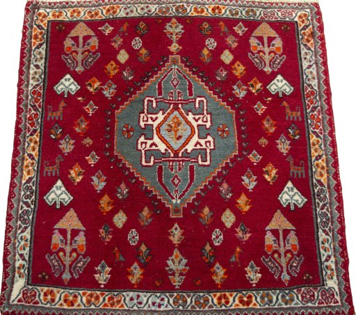 Surface texture of 2000s Shiraz rug with natural Wool and intricate pattern
