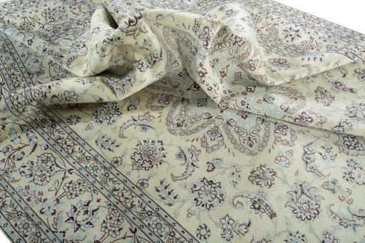 Surface texture of 2000s Nain rug with natural Wool and intricate pattern