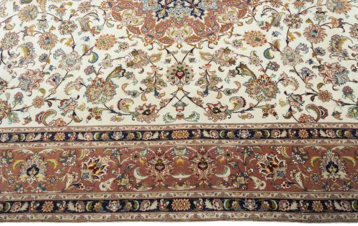 Corner detail of 2000s Tabriz 50/60/70 Raj rug showing border pattern and Cork pile