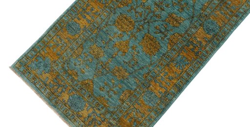 Backside of handmade New Farahan rug showing knot structure and weave density