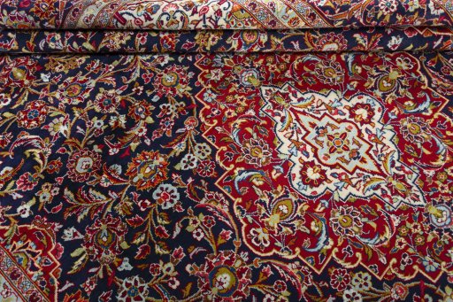 Close-up detail of 2000s Kashan rug from Iran / Persia showing Wool weave