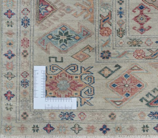 Corner detail of New Kazak rug showing border pattern and Wool pile