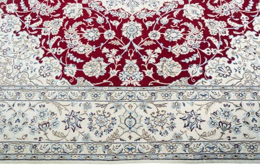 Corner detail of New Nain rug showing border pattern and Wool pile