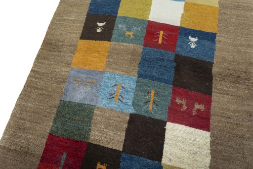 Backside of handmade 2000s Persian Gabbeh rug showing knot structure and weave density