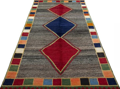 Surface texture of 1970s Persian Gabbeh rug with natural Wool and intricate pattern