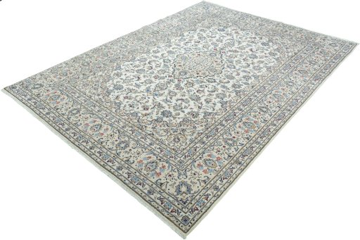 Corner detail of 2000s Kashan rug showing border pattern and Wool pile