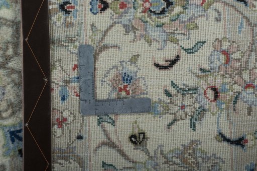 Backside of handmade New Kashan rug showing knot structure and weave density