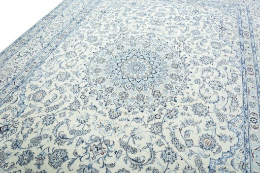 Backside of handmade New Nain rug showing knot structure and weave density