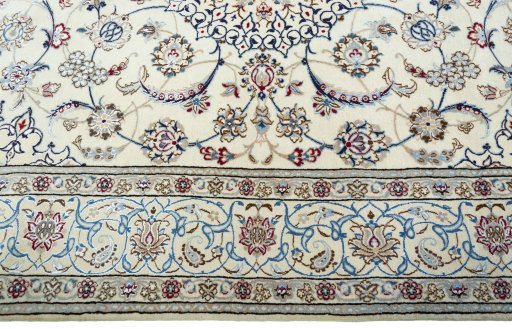 Corner detail of 2000s Nain rug showing border pattern and Wool pile