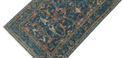 Backside of handmade New Farahan rug showing knot structure and weave density