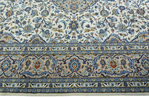 Corner detail of 2000s Kashan rug showing border pattern and Wool pile