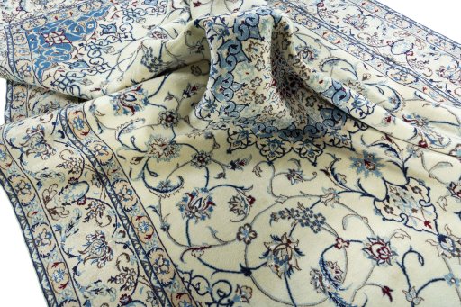Surface texture of 2000s Nain rug with natural Wool and intricate pattern