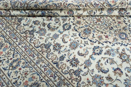 Close-up detail of 2000s Kashan rug from Iran / Persia showing Wool weave