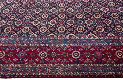 Close-up detail of 2000s Mashad rug from Iran / Persia showing Wool weave