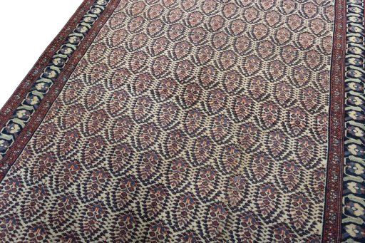 Backside of handmade 1930s Hamedan rug showing knot structure and weave density