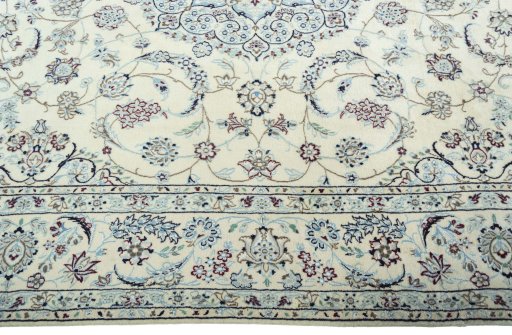 Corner detail of 2000s Nain rug showing border pattern and Wool pile