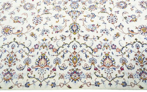 Corner detail of New Kashan rug showing border pattern and Wool pile