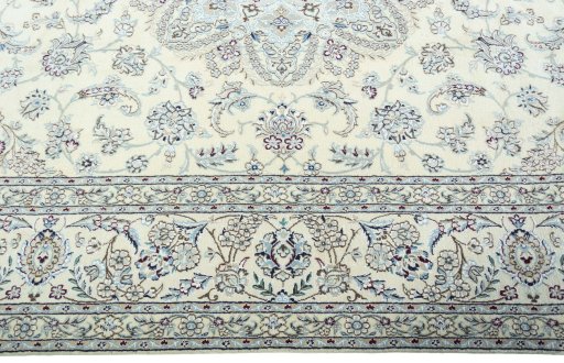 Corner detail of 2000s Nain rug showing border pattern and Wool pile