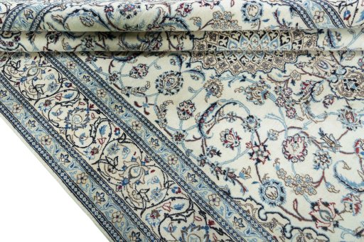 Close-up detail of 2000s Nain rug from Iran / Persia showing Wool weave