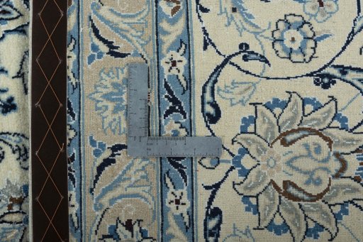 Backside of handmade New Nain rug showing knot structure and weave density