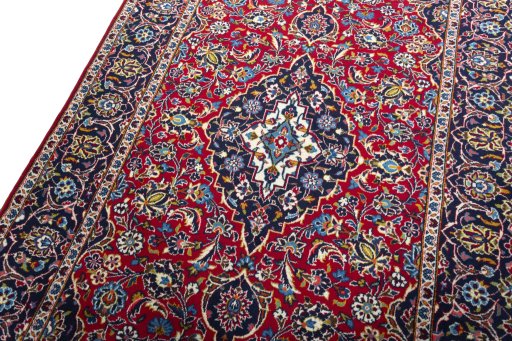 Backside of handmade 2000s Kashan rug showing knot structure and weave density