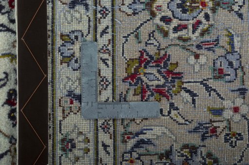 Backside of handmade 2000s Kashan rug showing knot structure and weave density