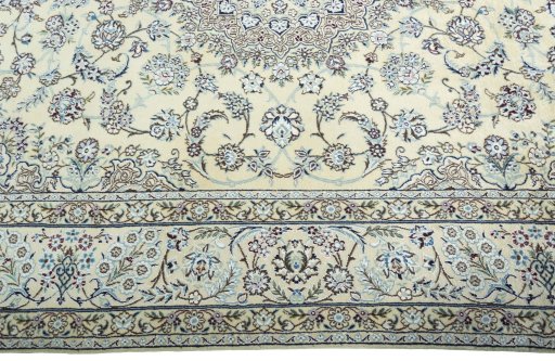 Corner detail of 2000s Nain rug showing border pattern and Wool pile
