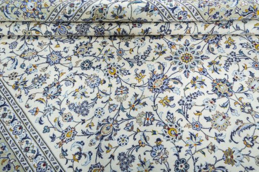 Close-up detail of 2000s Kashan rug from Iran / Persia showing Wool weave