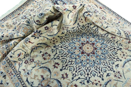 Surface texture of 2000s Nain rug with natural Wool and intricate pattern