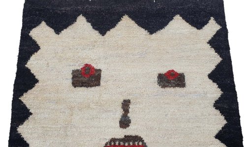 Backside of handmade New Morocco rug showing knot structure and weave density