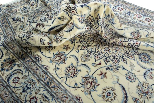 Surface texture of 2000s Nain rug with natural Wool and intricate pattern