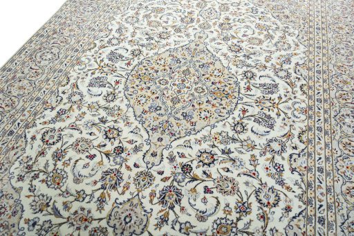 Backside of handmade 2000s Kashan rug showing knot structure and weave density