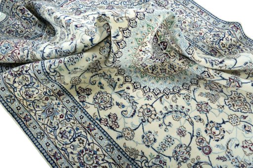 Surface texture of 2000s Nain rug with natural Wool and intricate pattern